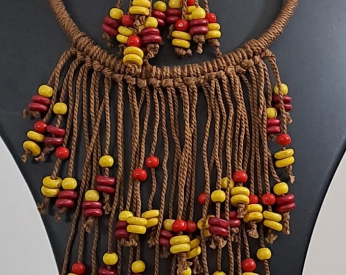 Exclusive brown thread neckband with fringes and matching earrings.