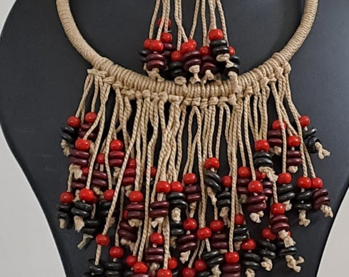 Exclusive beige thread neckband with fringes and matching earrings.