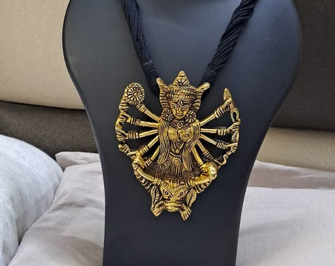 Black thread necklace with oxidised golden durga pendant