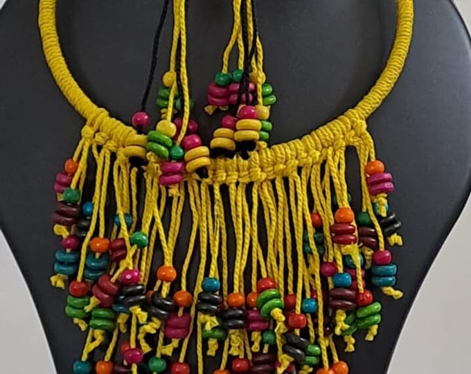 Exclusive yellow thread neckband with fringes and matching earrings.