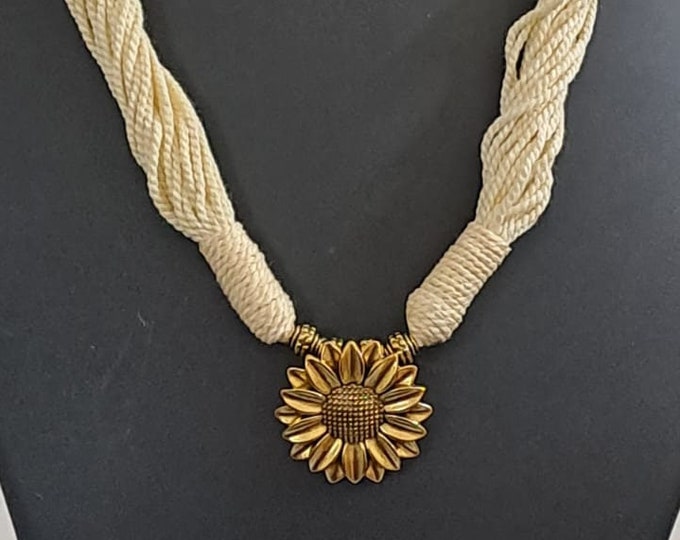 Off white thread necklace with oxidised silver sunflower pendant