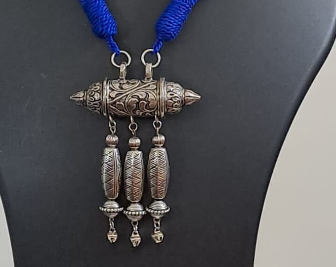 Blue thread necklace with silver oxidised traditional pendant