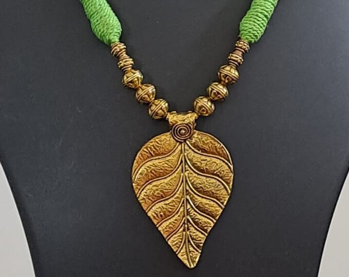 Green thread necklace with golden oxidised golden leaf traditional pendant
