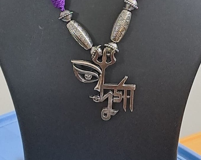 Purple thread necklace with oxidised silver durga pendant