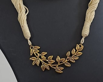 Off white thread necklace with Golden oxidised traditional pendant