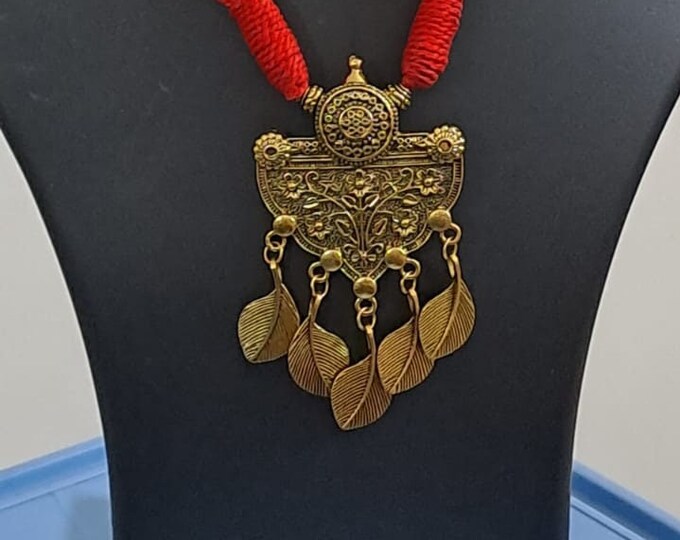 Red thread necklace with golden oxidised traditional pendant