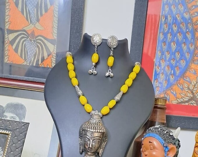 Yellow glass beads necklace with buddha pendant