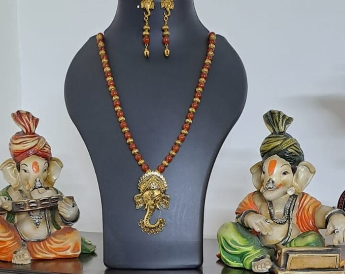 Orange glass beads necklace with Lord Ganesha pendant
