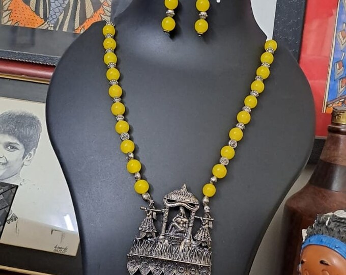 Yellow glass beads necklace with oxidised silver pendant