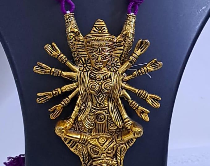 Purple thread necklace with oxidised golden durga pendant