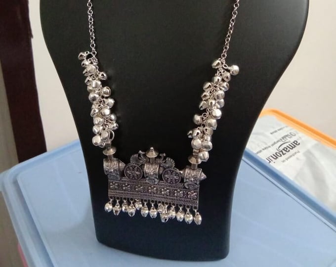 Oxidised silver chain with traditional pendant and matching earrings.