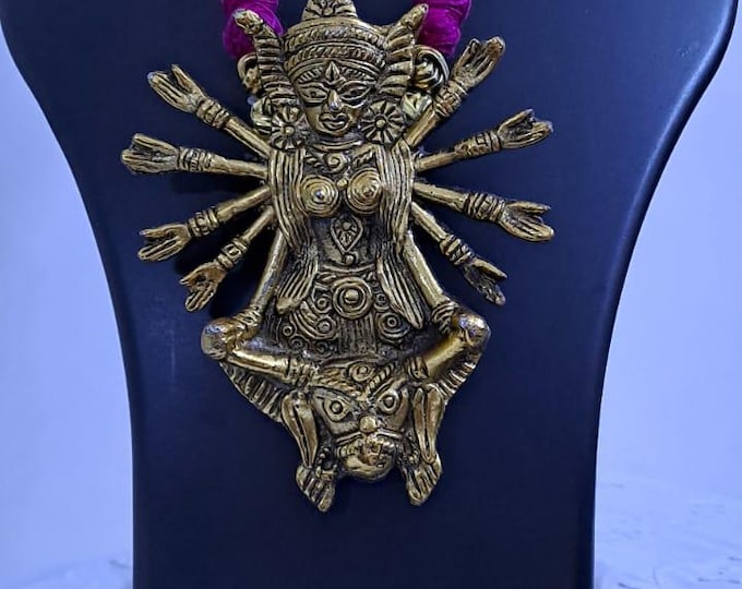 Pink thread necklace with oxidised golden durga pendant