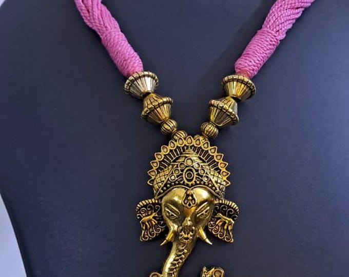 Pink thread necklace with Golden oxidised traditional pendant