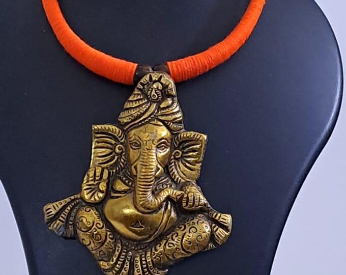 Orange thread necklace with golden oxidised ganesha pendant