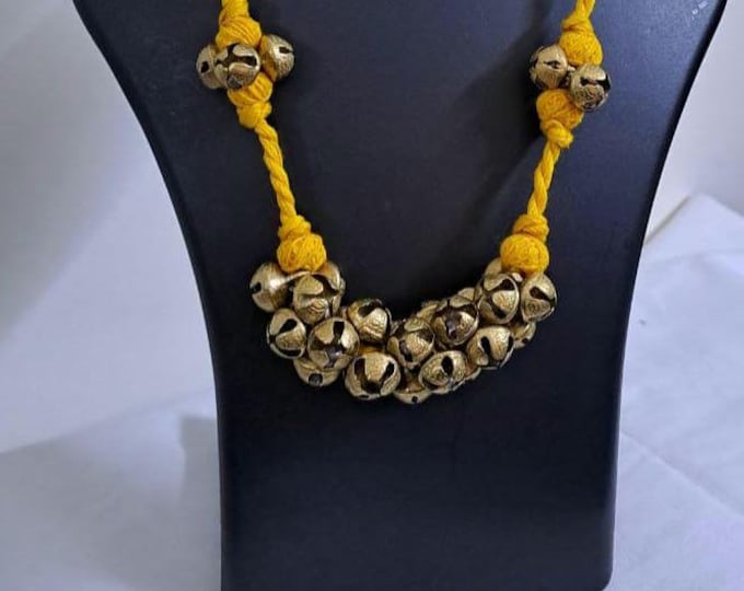 Yellow thread necklace with trinkets n matching earrings