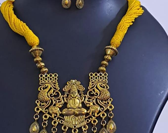 Yellow thread necklace with Golden oxidised traditional pendant