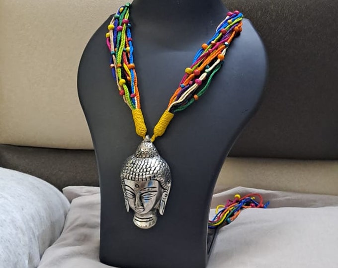 Multi coloured thread necklace with oxidised silver buddha pendant