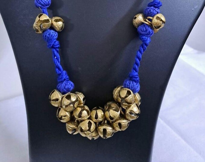 Blue thread necklace with trinkets n matching earrings