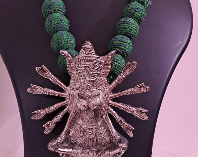 Green thread necklace with oxidised golden durga pendant