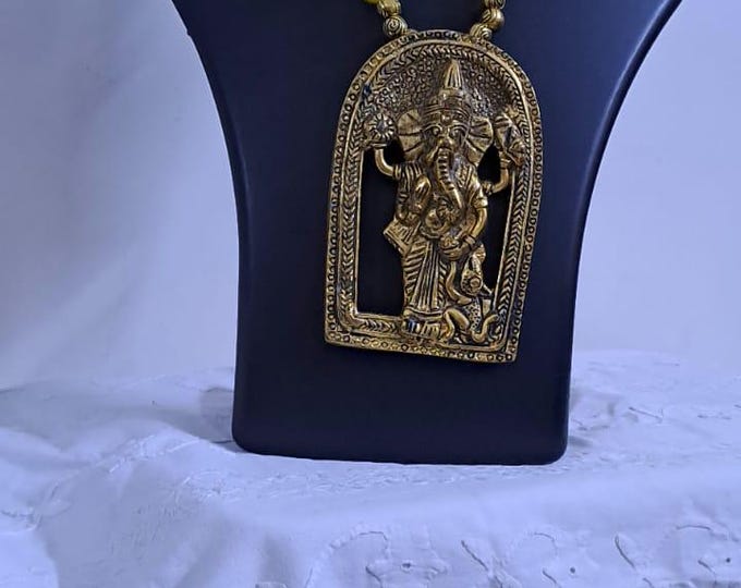 Yellow thread necklace with golden oxidised ganesha pendant