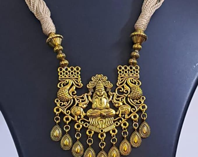Off white thread necklace with Golden oxidised traditional pendant