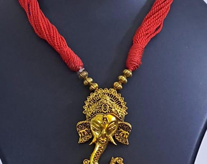 Red thread necklace with Golden oxidised traditional pendant