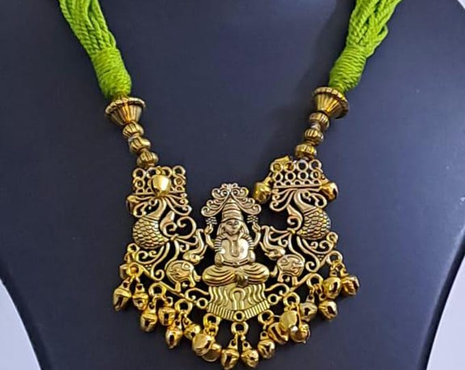 Light green thread necklace with Golden oxidised traditional pendant