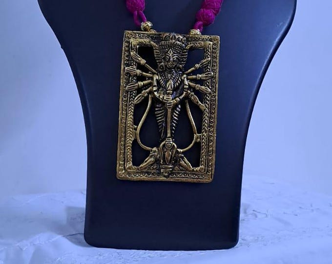 Pink thread necklace with oxidised golden durga pendant