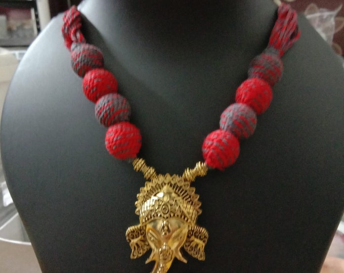 Oxidised golden ganesha traditional pendant and matching earrings.
