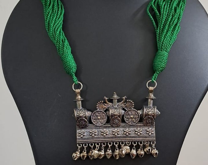 Green thread necklace with silver oxidised traditional pendant