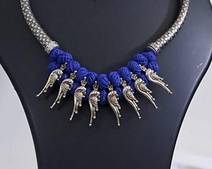 Blue thread necklace with kolhapuri silver oxidised traditional beads and matching earrings