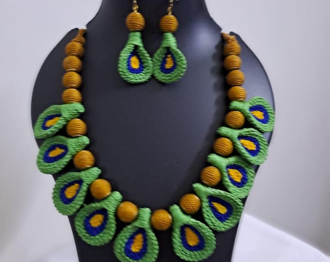 Green n yellow thread necklace with matching thread earrings.
