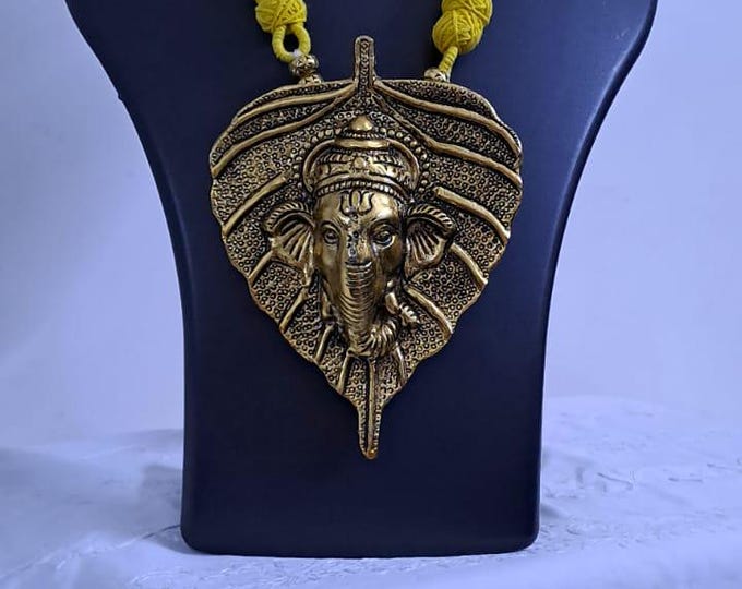 Yellow thread necklace with golden oxidised ganesha pendant