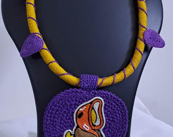 Exclusive yellow and purple thread necklace with leaf shaped  Ganesha thread pendant and matching earrings.