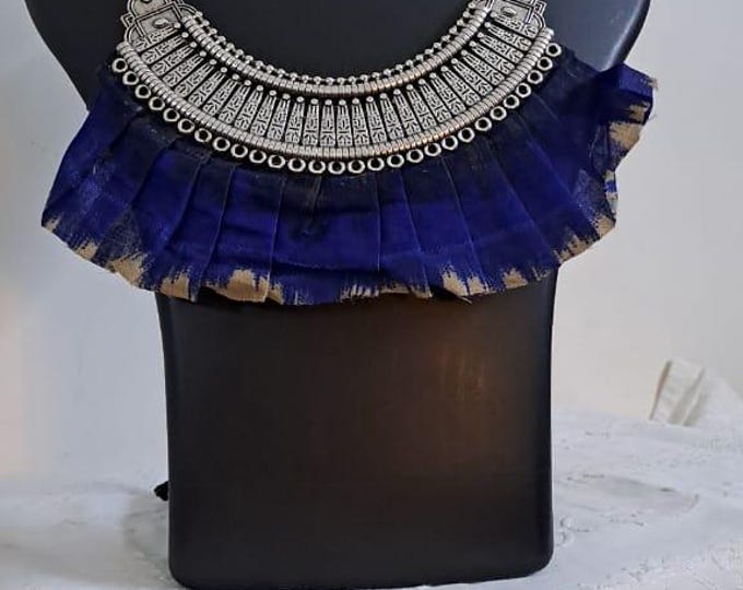 Exclusive necklace with silver oxidised big oval pendant with fabric fringes and matching earrings.