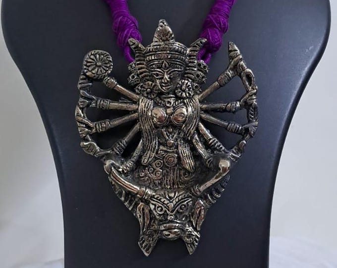 purple thread necklace with oxidised golden durga pendant