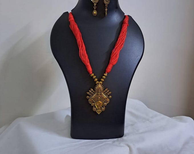Red thread jewellery set with golden durga pendant n matching earrings