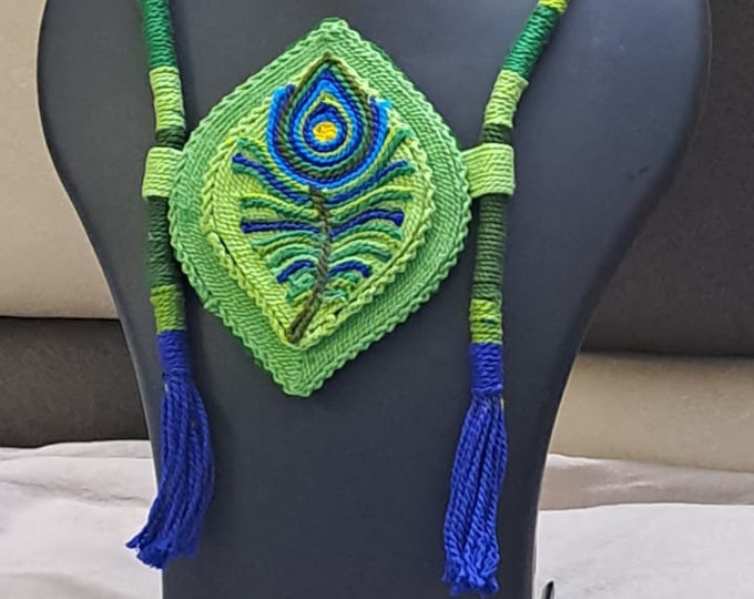Thread necklace depicting peacock feather with shades of green. Exclusively for Janmashtami
