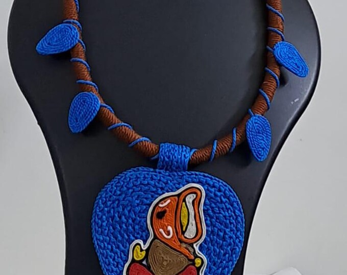Exclusive brown and blue thread necklace with leaf shaped  Ganesha thread pendant and matching earrings.