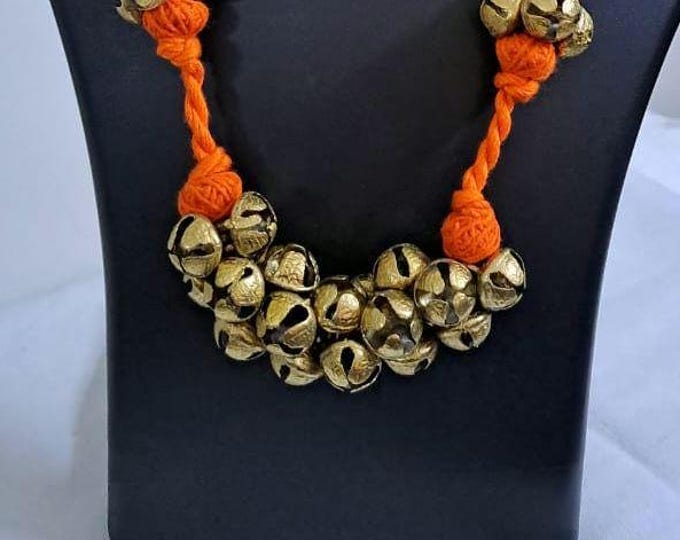 Orang thread necklace set with trinkets n matching earrings