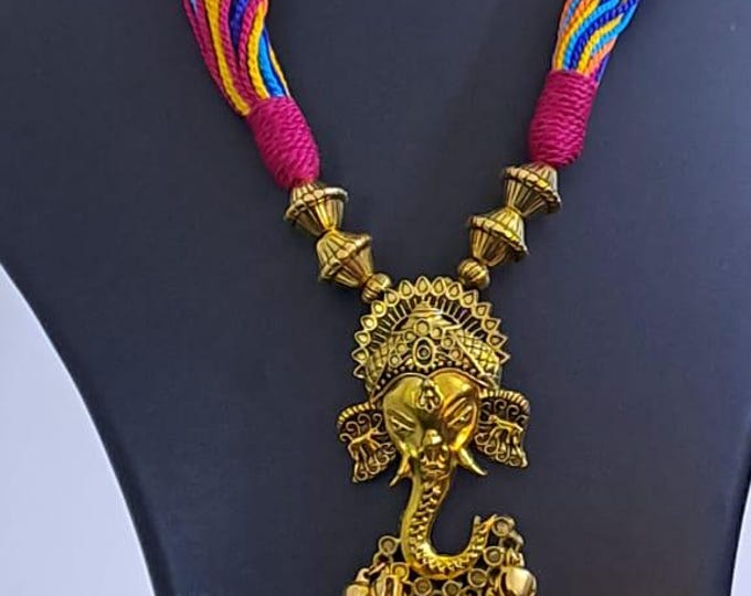 Multicoloured thread necklace with Golden oxidised traditional pendant