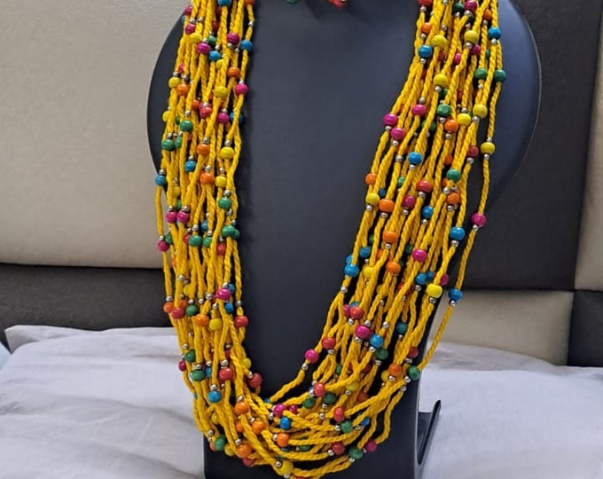 Yellow Multi layered necklace with colouful beads and with matching earrings.