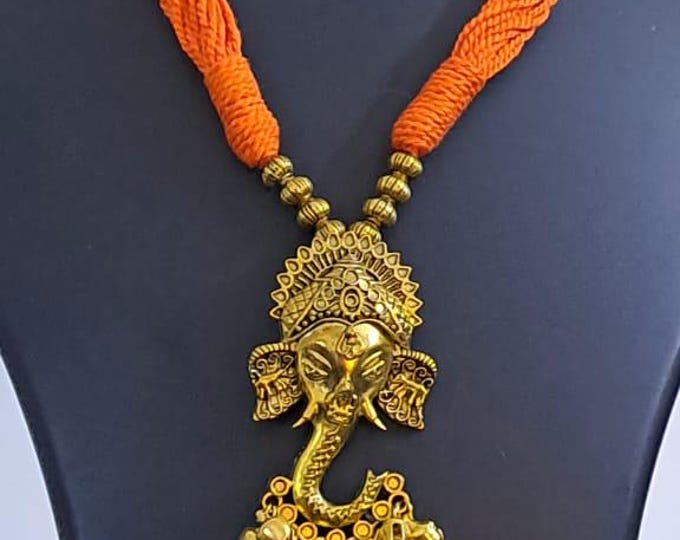 Orange thread necklace with Golden oxidised traditional pendant