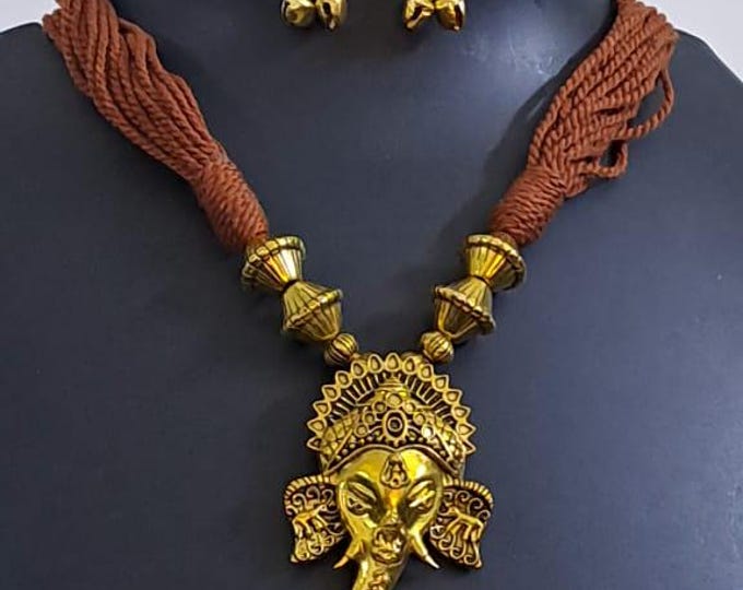 Brown thread necklace with Golden oxidised traditional pendant