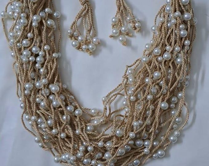 Multi layered jute necklace with pearl beads and with matching earrings.
