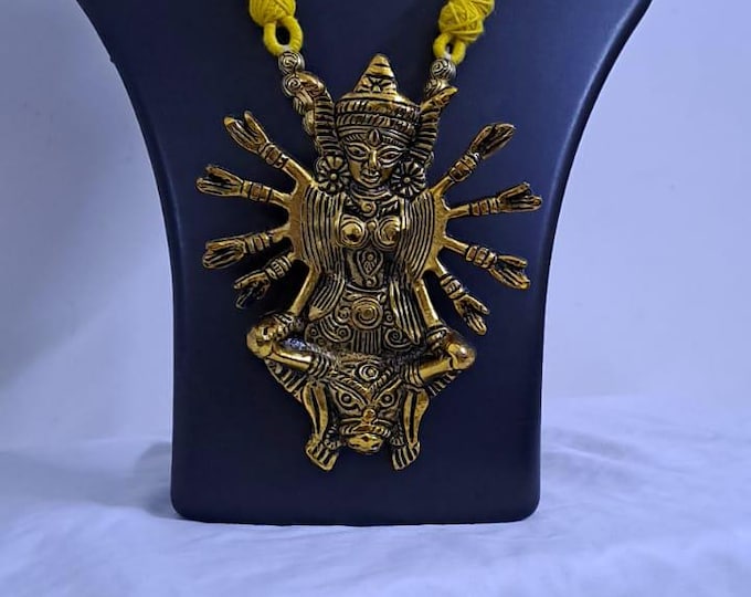 Yellow thread necklace with oxidised golden durga pendant