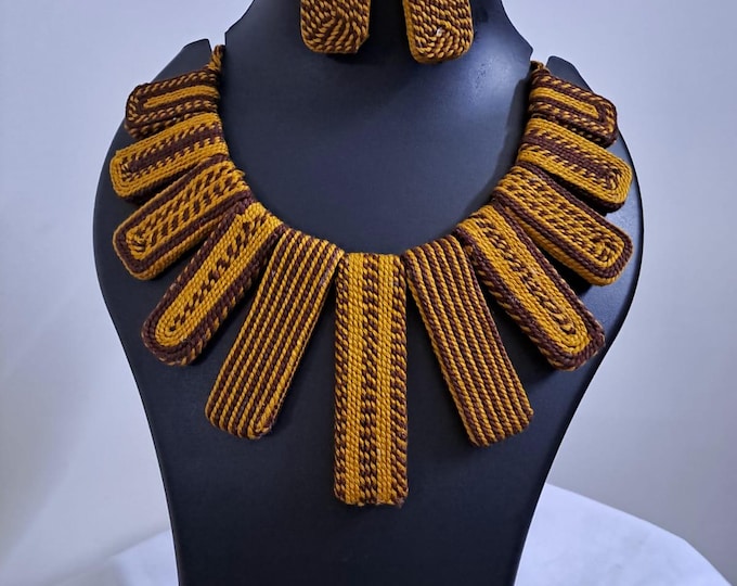 Exclusive brown n yellow thread necklace with rectangle shape thread beads and matching earrings.