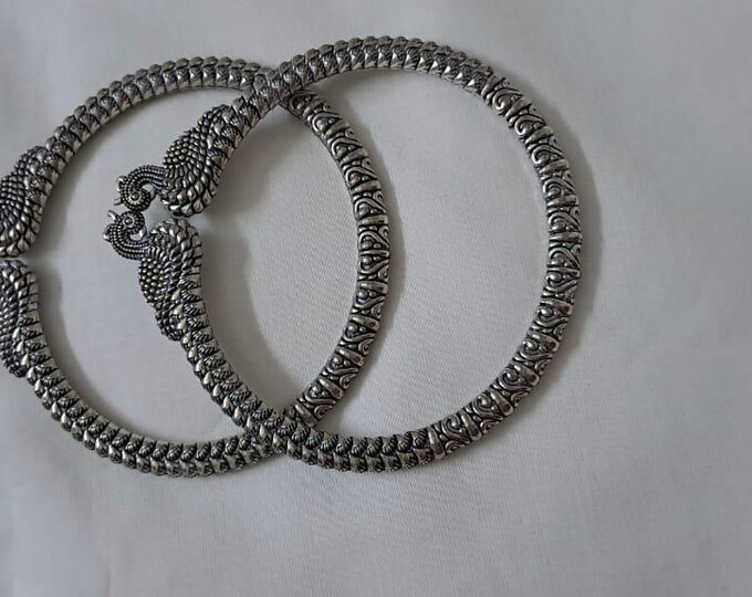 Traditional silver oxidised bangles with peacock
