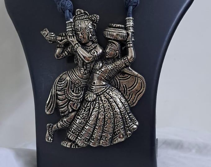 Radha Krishna golden oxidised pendant necklace in grey thread with matching earrings