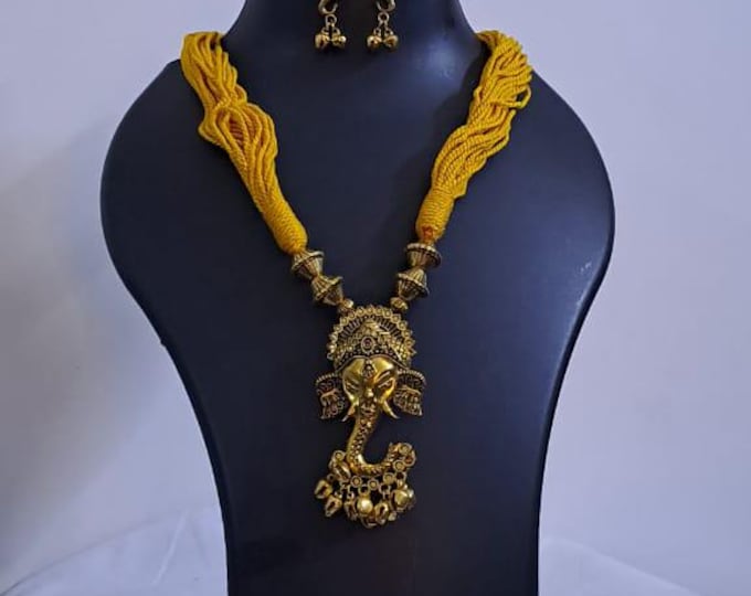 Yellow thread necklace with Golden oxidised traditional pendant